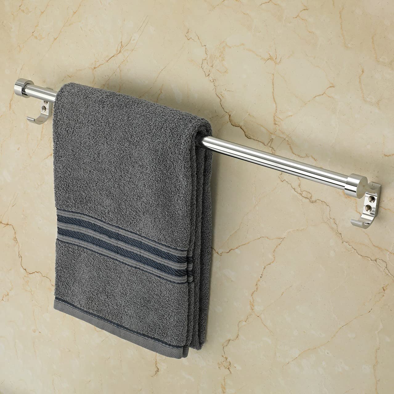 Round Stainless Steel 24 Inch Towel Rod with a grey colour hanging towel against a marbel wall background