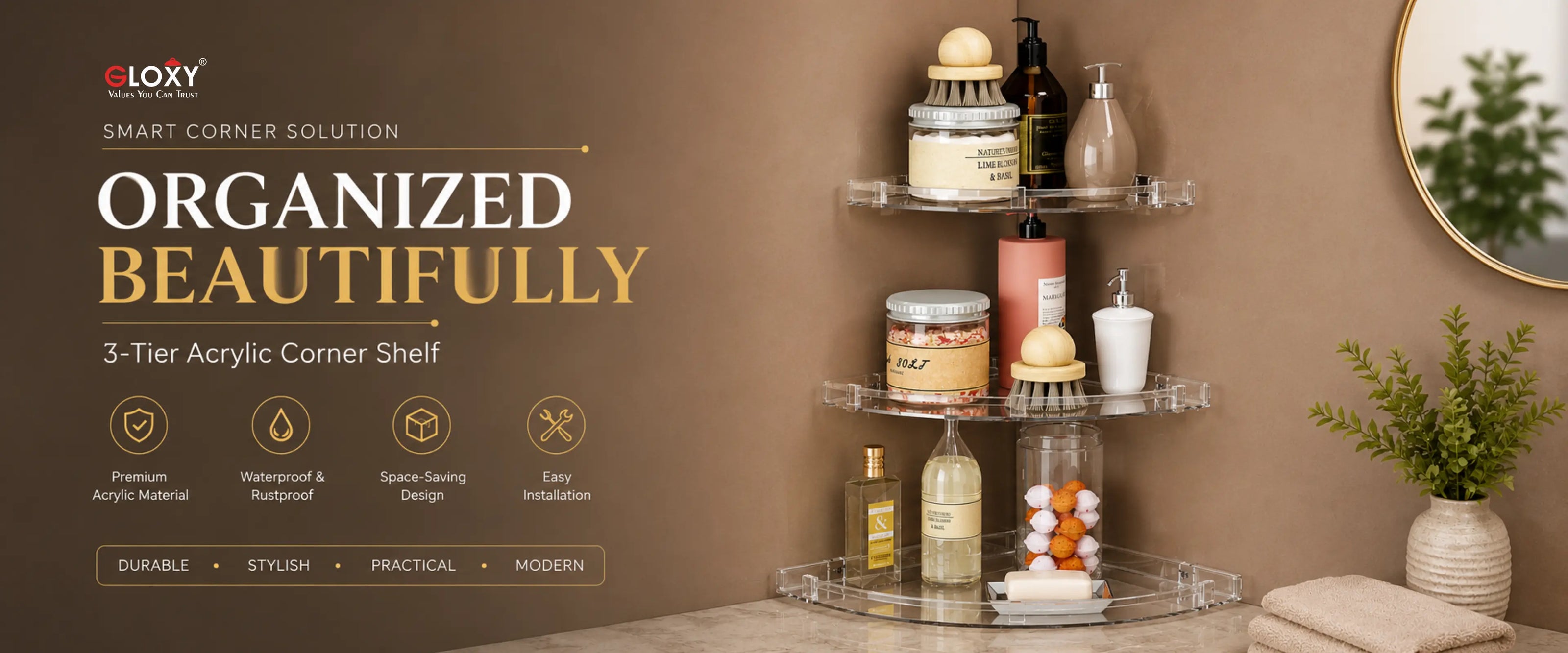 A 3-tier clear acrylic corner shelf organizer shown in a bathroom setting, holding toiletries and bottles. The left side features a brown graphic banner with the brand 'ELOXY' and the text 'ORGANIZED BEAUTIFULY' and '3-Tier Acrylic Corner Shelf'.