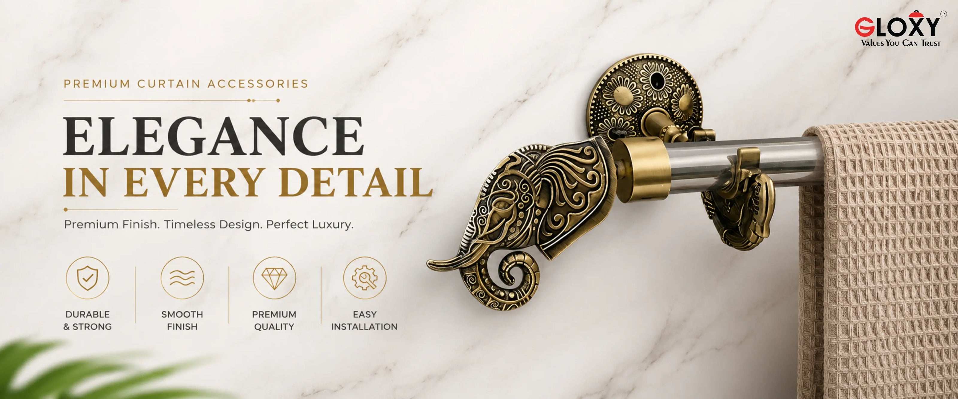 An ornate antique bronze curtain rod bracket with a decorative scrollwork design, shown mounted on a white marble wall next to a beige textured towel. The left side features promotional text reading 'ELEGANCE IN EVERY DETAIL' and the brand logo 'ELOXY' in the top right corner.