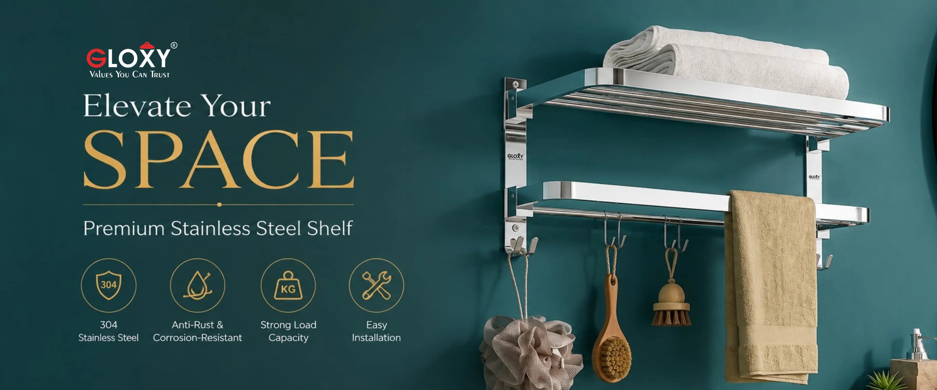 A two-tier stainless steel wall-mounted towel and shelf rack shown installed on a teal bathroom wall, with folded white towels on the top shelf, a beige towel hanging on the right rail, and small bathroom accessories below. The left side includes promotional text and feature icons for the GLOXY brand.