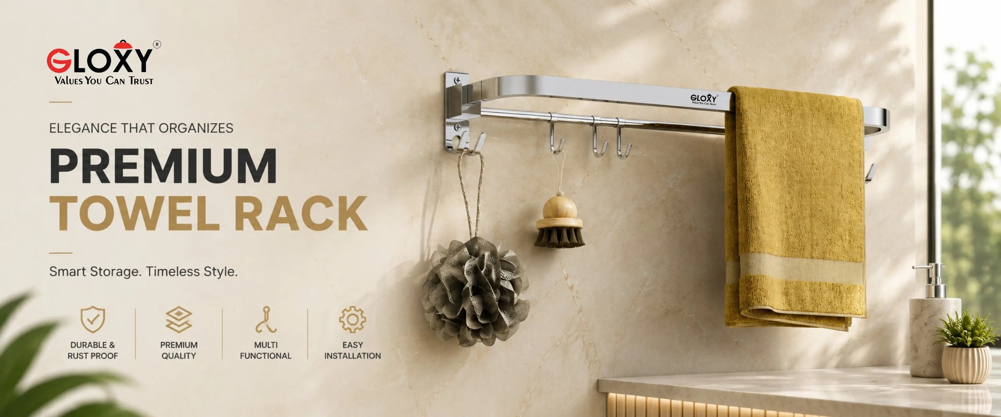 A wall-mounted silver towel rack with hooks and hanging accessories, shown installed in a bathroom setting with a yellow towel, soap dispenser, and small plant. The left side includes promotional text for the ELOXY Premium Towel Rack.