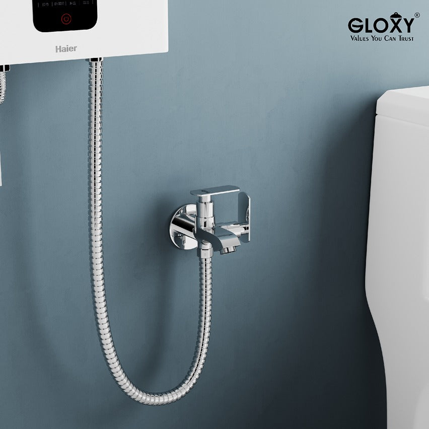 Chrome daboule lever angle valbe and hose mounted on a gray wall with Gloxy branding.