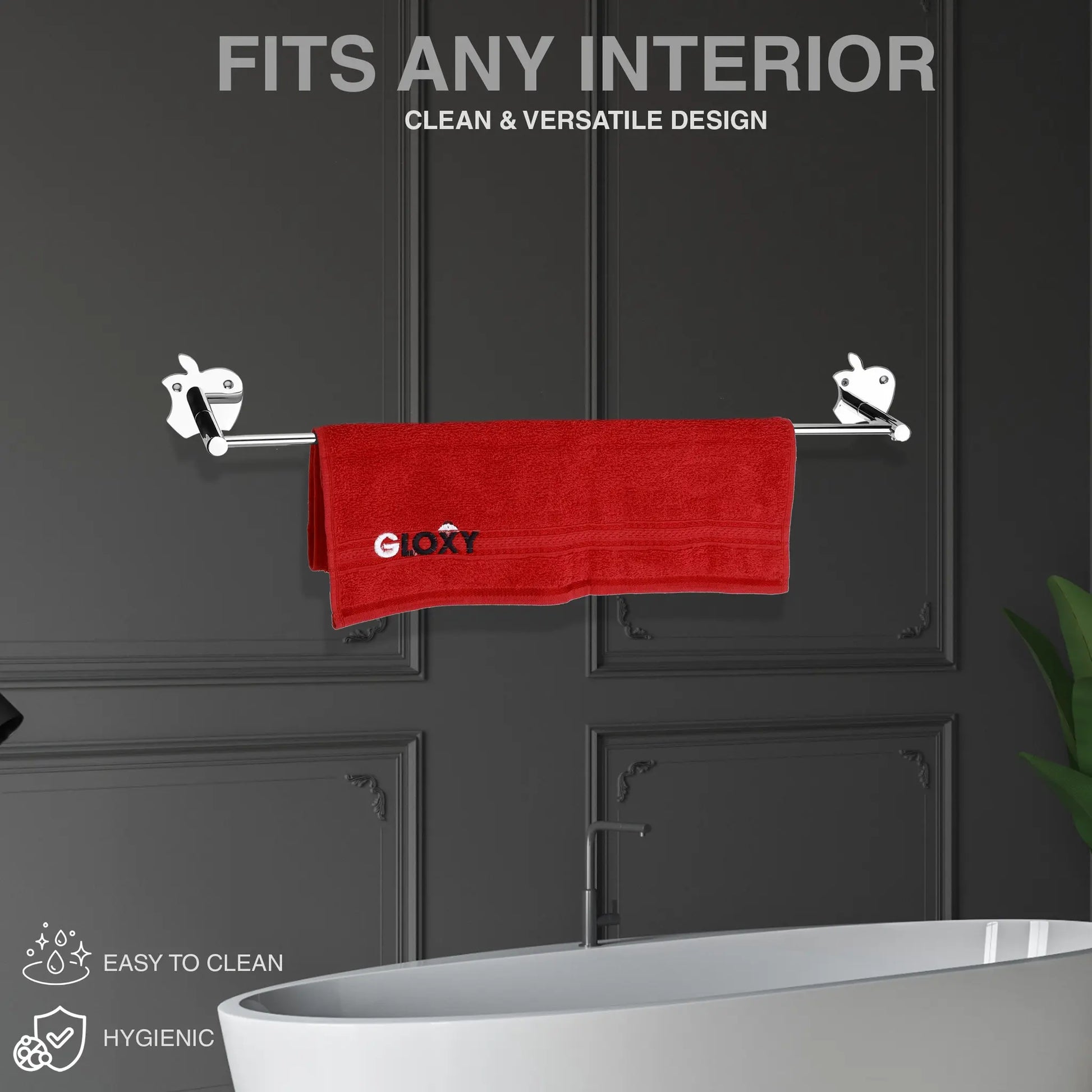 on a wall mounted towel rod a re towel hanging on  against a dark wall.