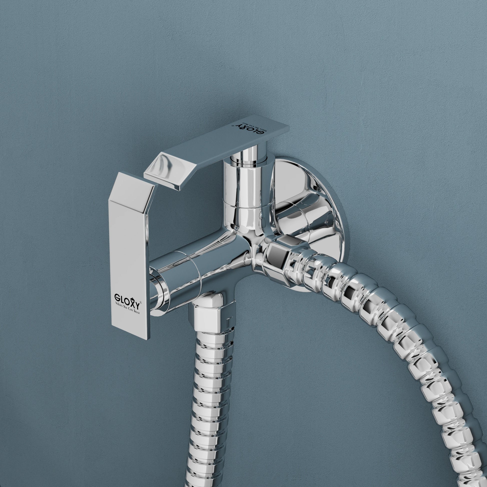 Chrome angle valve hose against a dark blue background