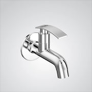 A chrome finish wall mount brass short body faucet tap valve, designed for use in bathrooms, kitchens, or for wash basins.