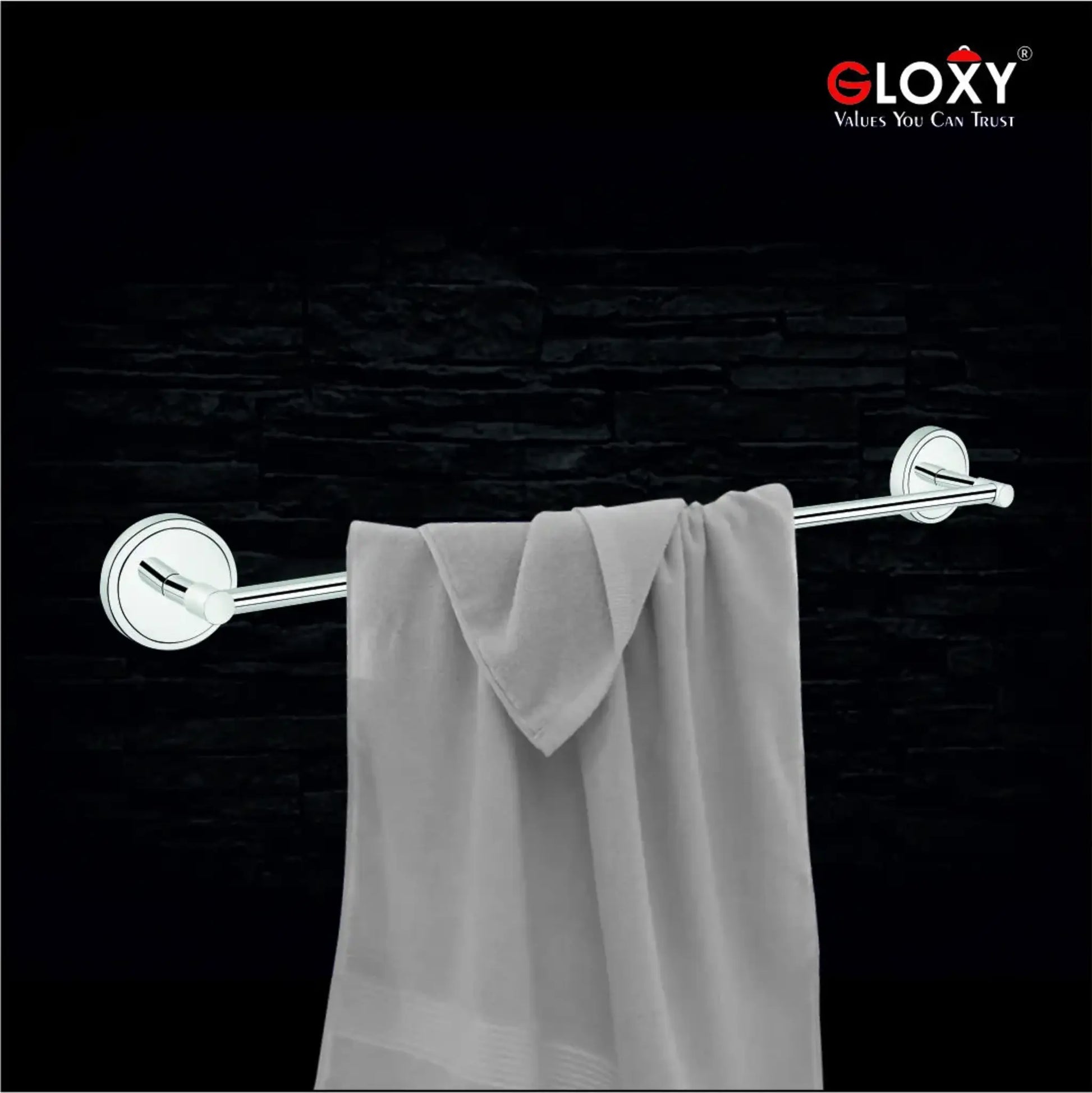 Towel rack with a gray towel against a black brick wall, featuring the Gloxy brand.