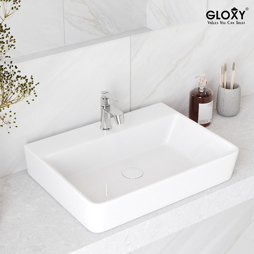 White rectangular sink with silver faucet in a bathroom setting, featuring Gloxy brand.