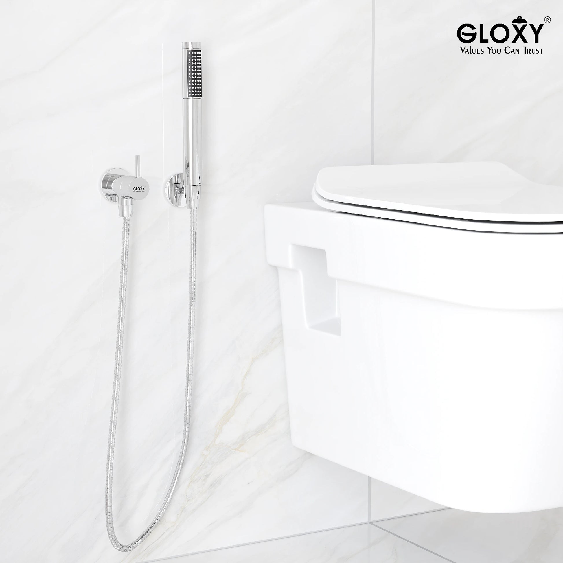 Handheld shower head attached to a wall over a toilet.