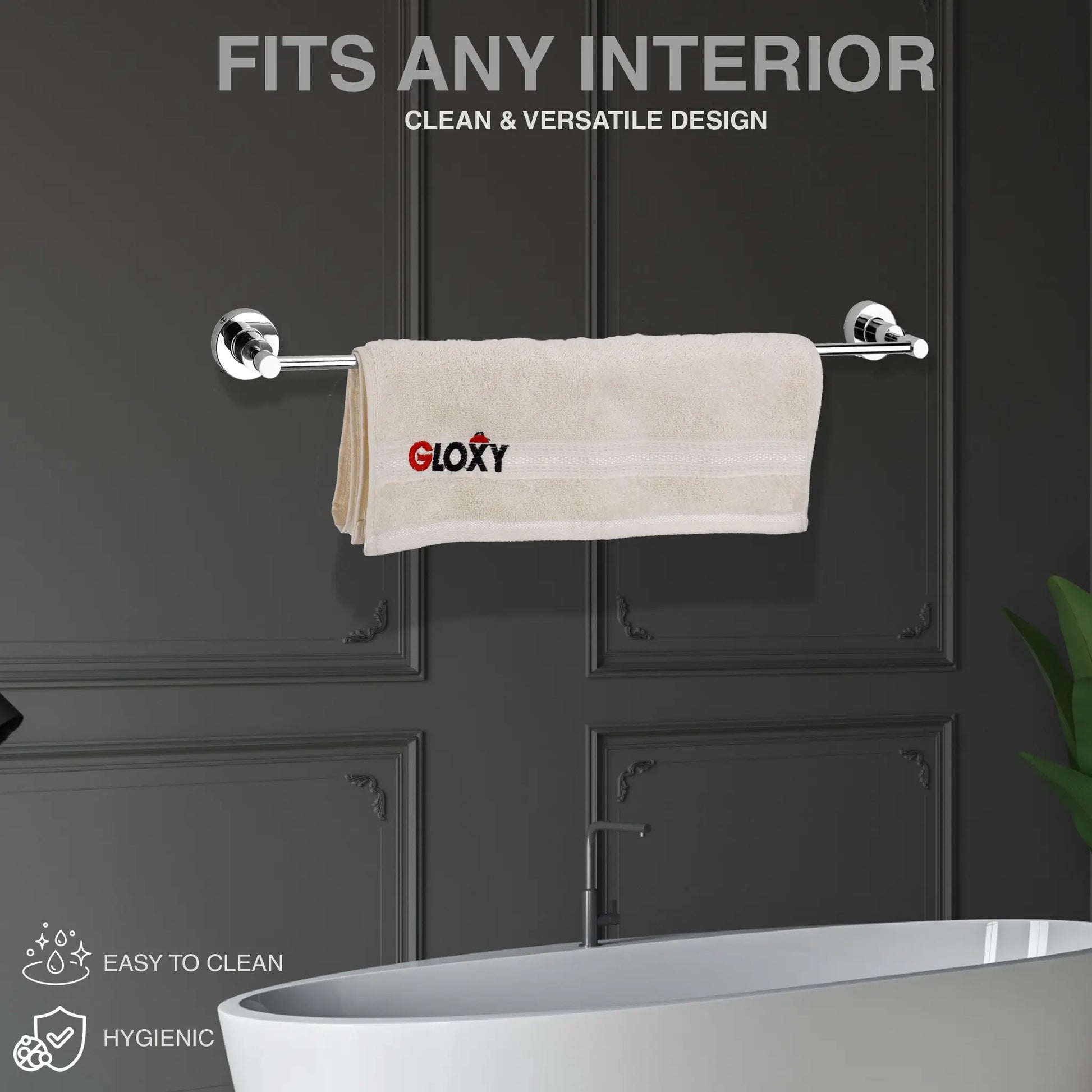  a silver towel rack wall mount against a dark panel wall and a beige towel hanging on it