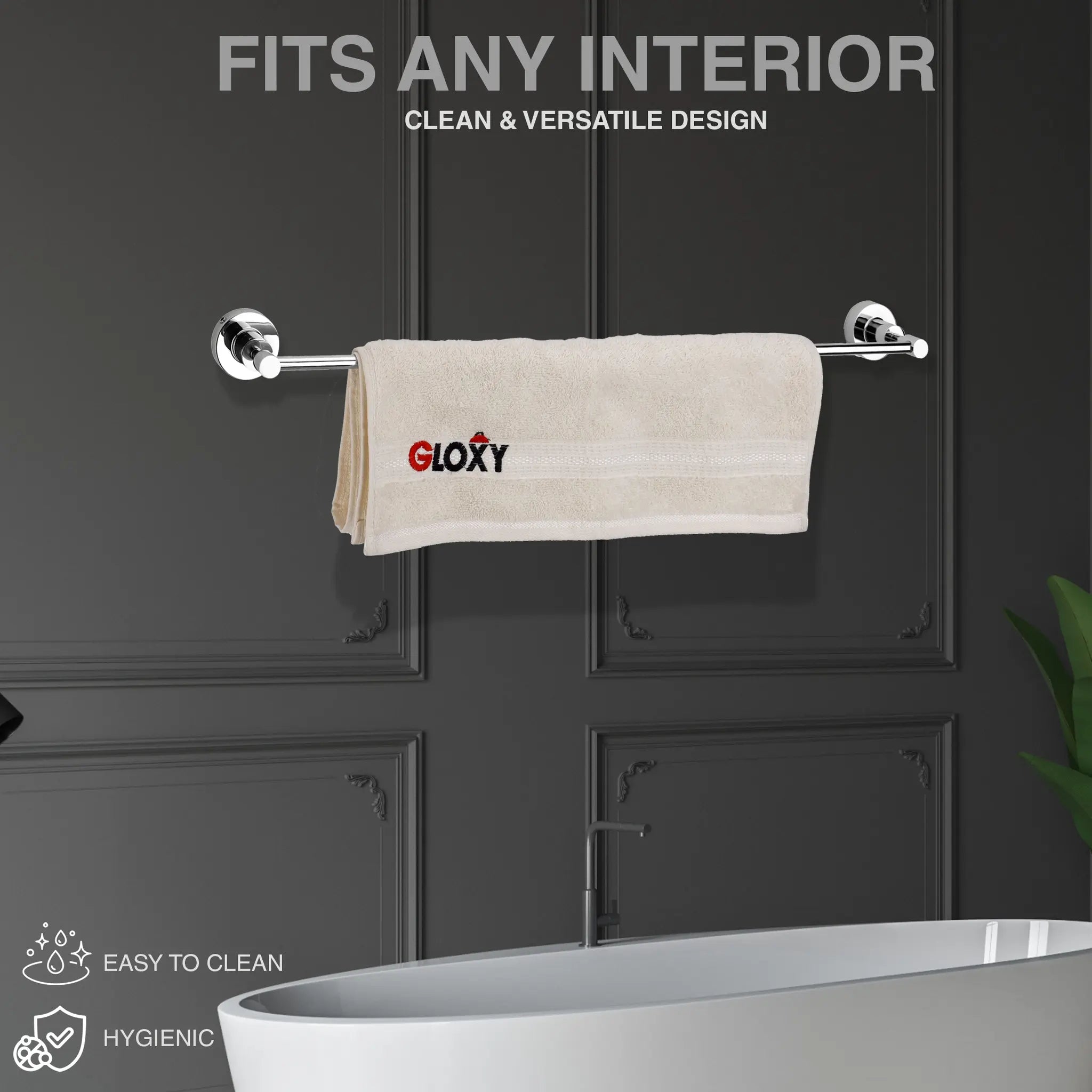  a silver towel rack wall mount against a dark panel wall and a beige towel hanging on it