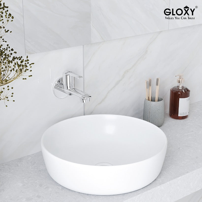 wall mounted water tap with a white sink