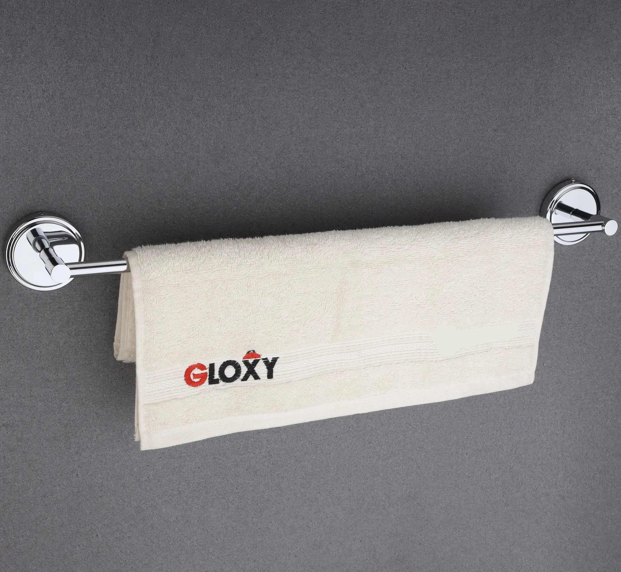  a towel rack mount on a gray wall with a beige towel 